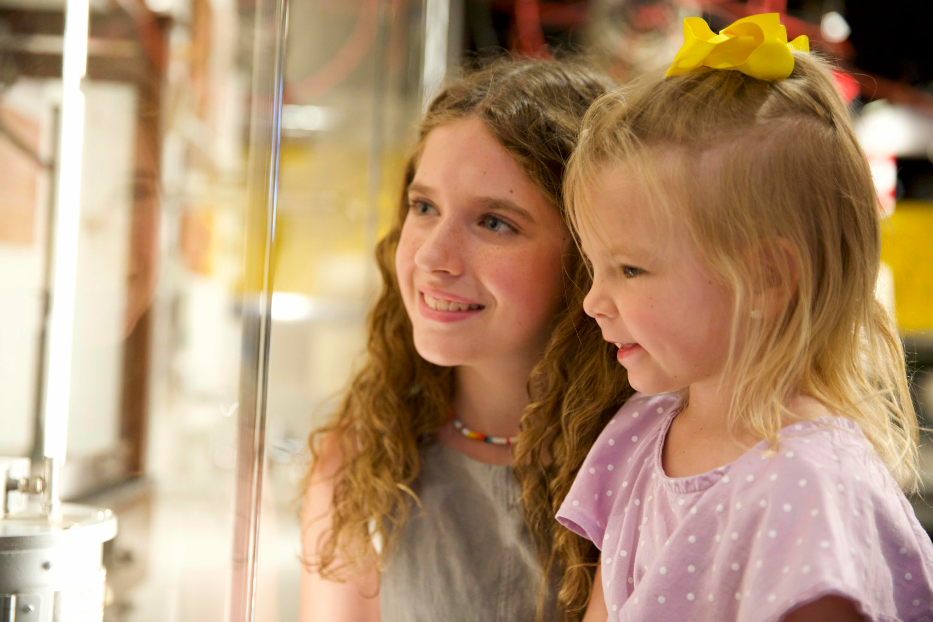 Two smiling young girls representing the next generation served by Roane County's united business voice