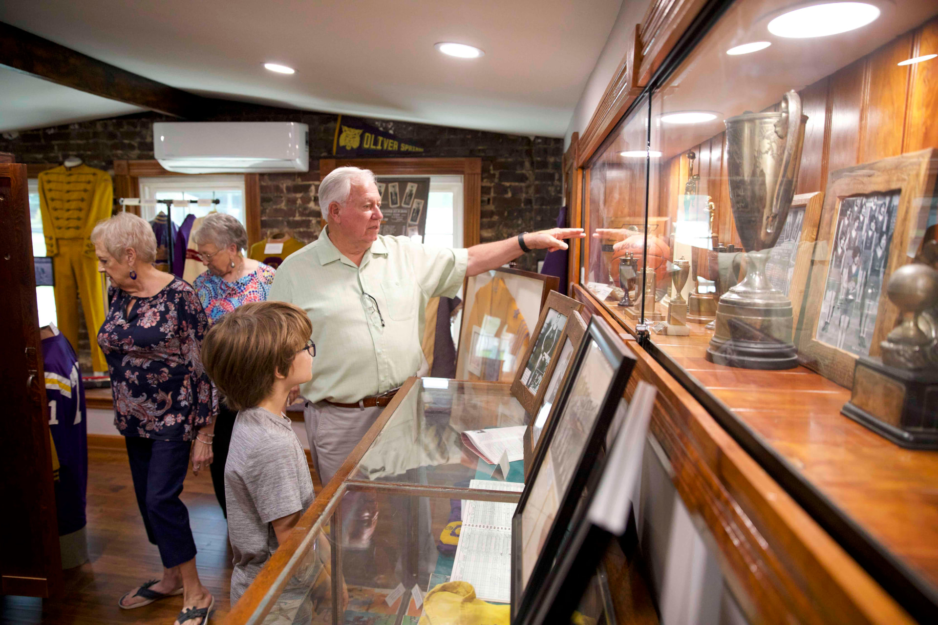A multi-generational family exploring local history and heritage displays