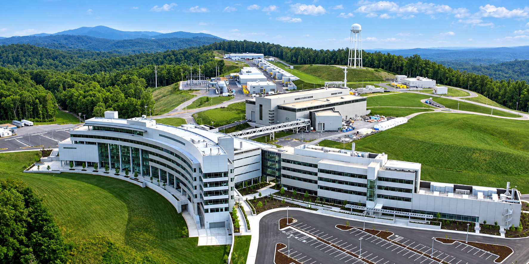 Aerial view of a modern research and innovation campus surrounded by green hills in East Tennessee
