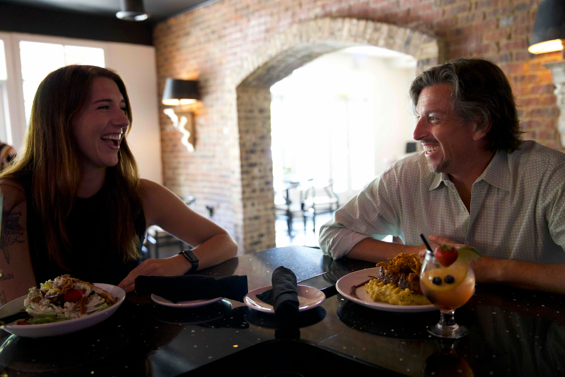 A couple enjoying a meal together in a downtown Roane County restaurant