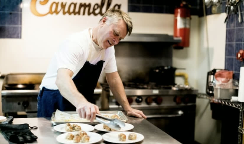 Chef plating a dish in a Roane County restaurant kitchen